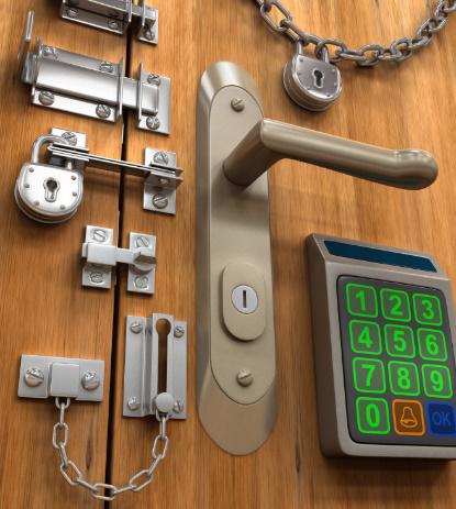 Numerous different types of locks on a door.